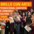 Vecinos y artistas celebrando el éxito rotundo de la muestra de arte internacional y gratuita Semillas de Armonía en la Casa de la Cultura de Merlo.
